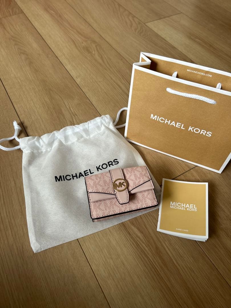 MICHAEL KORS ピンク GREENWICHフラップ トライフォールド
