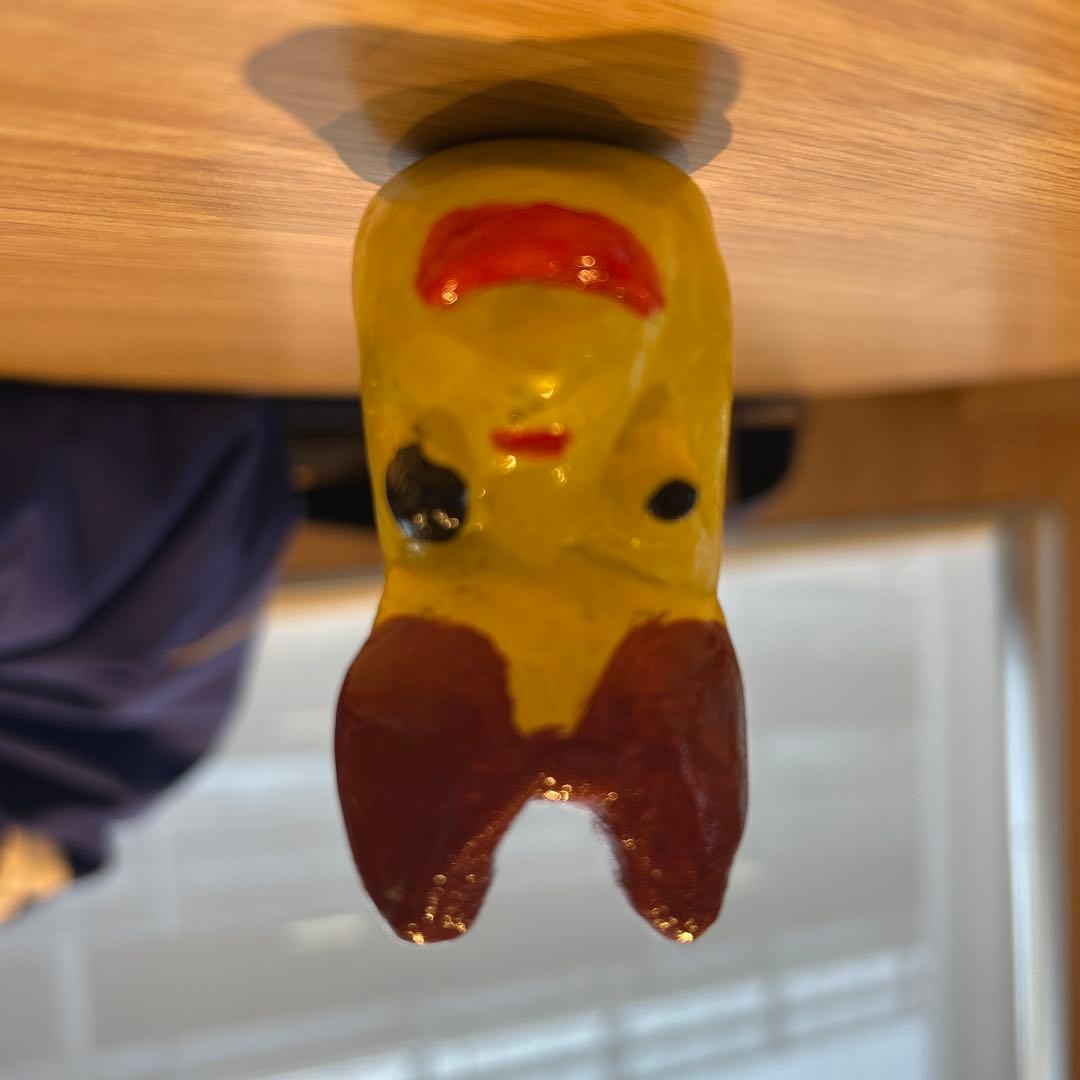 黄色の顔型小物入れ