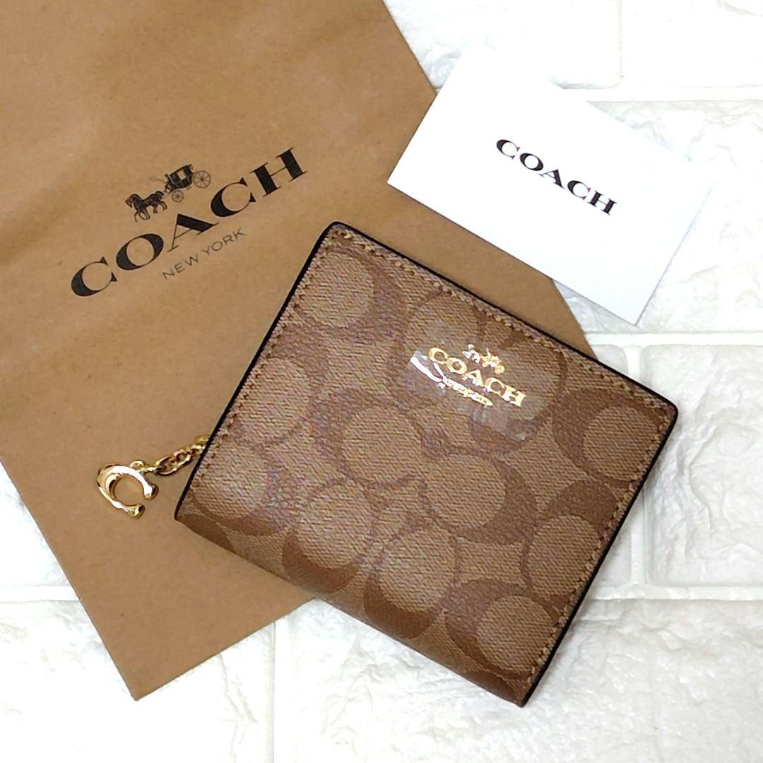 新品未使用⭐COACH ブラウン 二つ折り財布　シグネチャー　馬車ロゴ