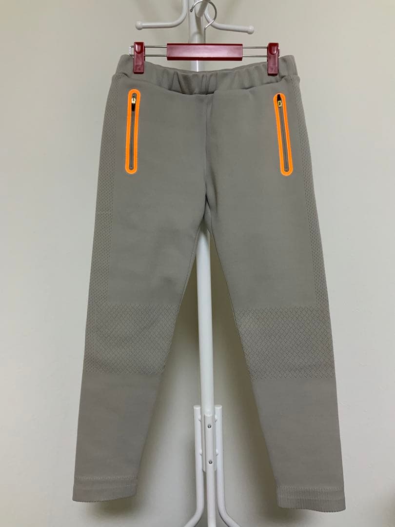 マークアンドロナレディースパンツ オレンジジッパー