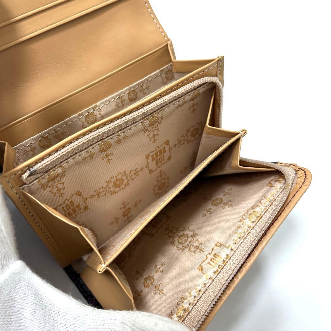 【人気モデル‼︎】ANNA SUI ルーミー　二つ折り財布　薔薇型押し　パープル