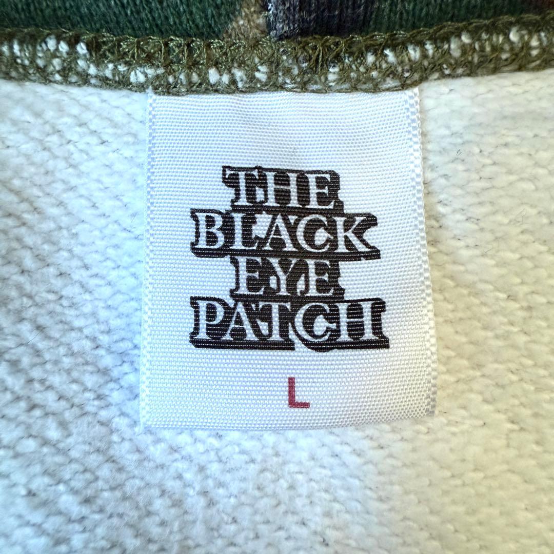 【入手困難✨】ブラックアイパッチ 取扱注意 刺繍ロゴ パーカー 迷彩柄 Lサイズ