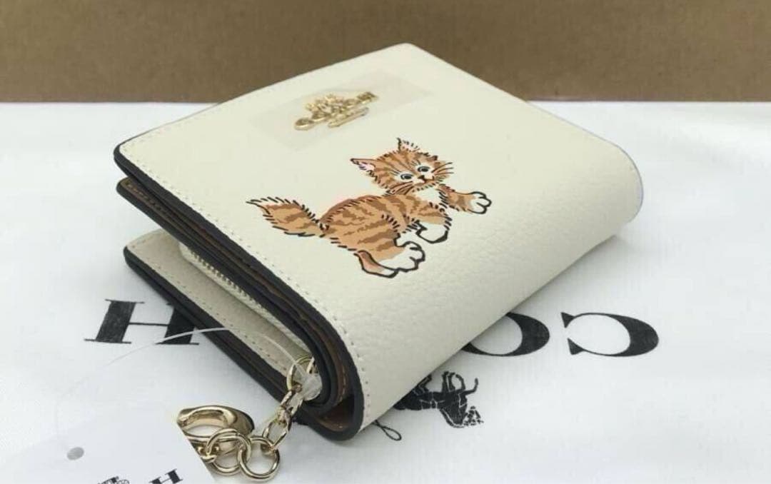 COACH 猫イラスト 二つ折り財布 ホワイト