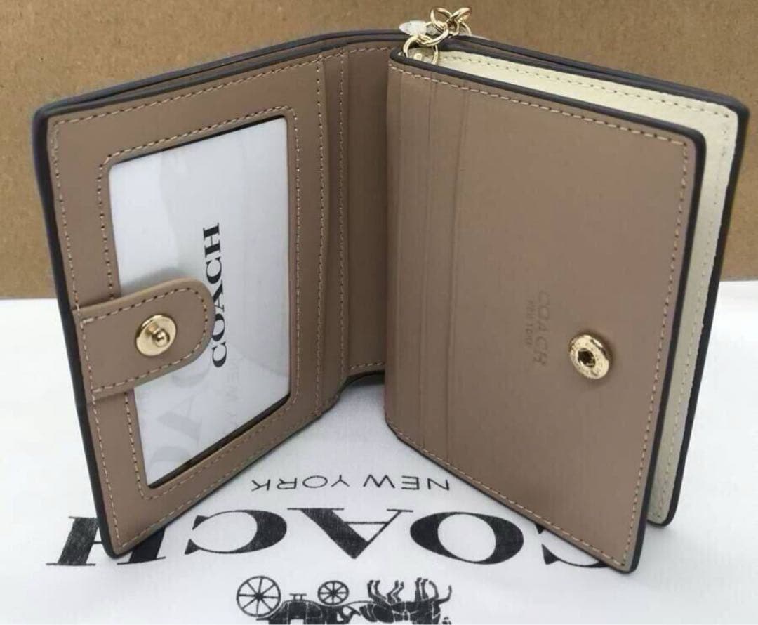 COACH 猫イラスト 二つ折り財布 ホワイト