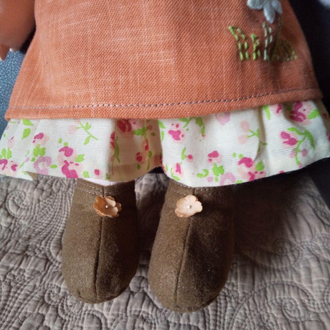 ステキなオレンジ色のエプロンを した らんちゃんです。 米山京子さん風