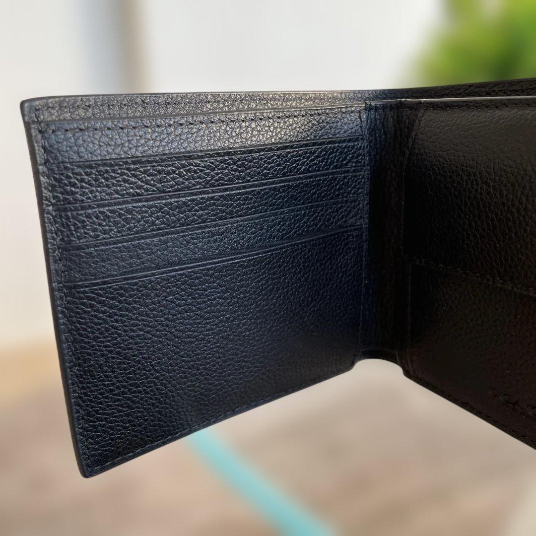 未使用　定価49,500円　COACH ブラック 二つ折り財布 ポケット付