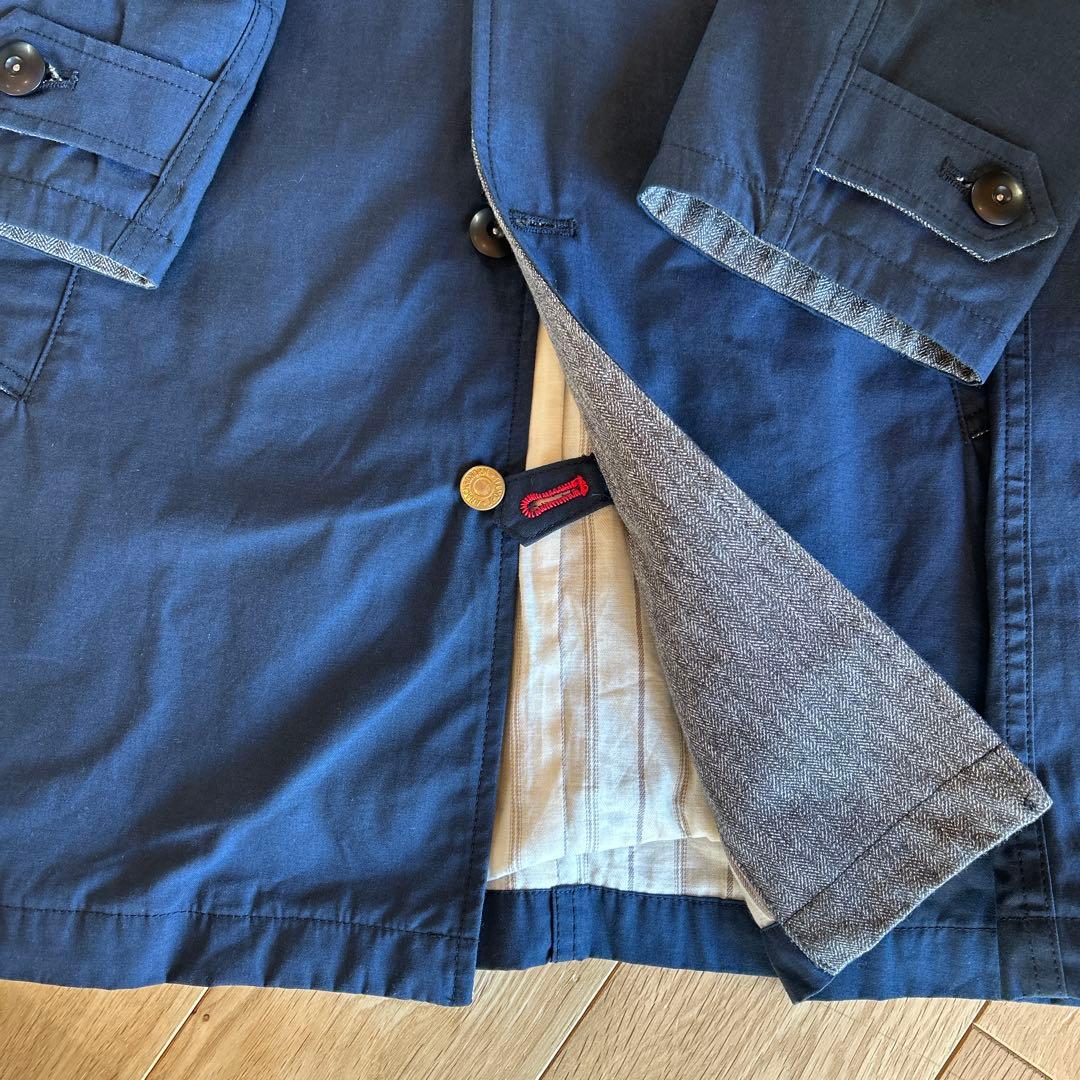 ANACHRONORMのステンカラーコート