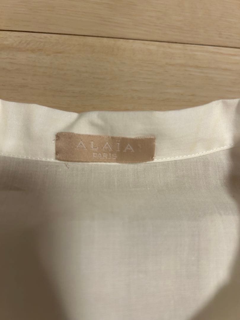 最終お値下げです。 Alaïa フリル付きホワイトブラウス　36サイズ