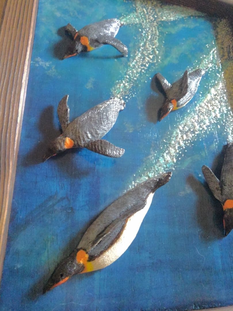 木彫りの皇帝ペンギンの3D壁掛け