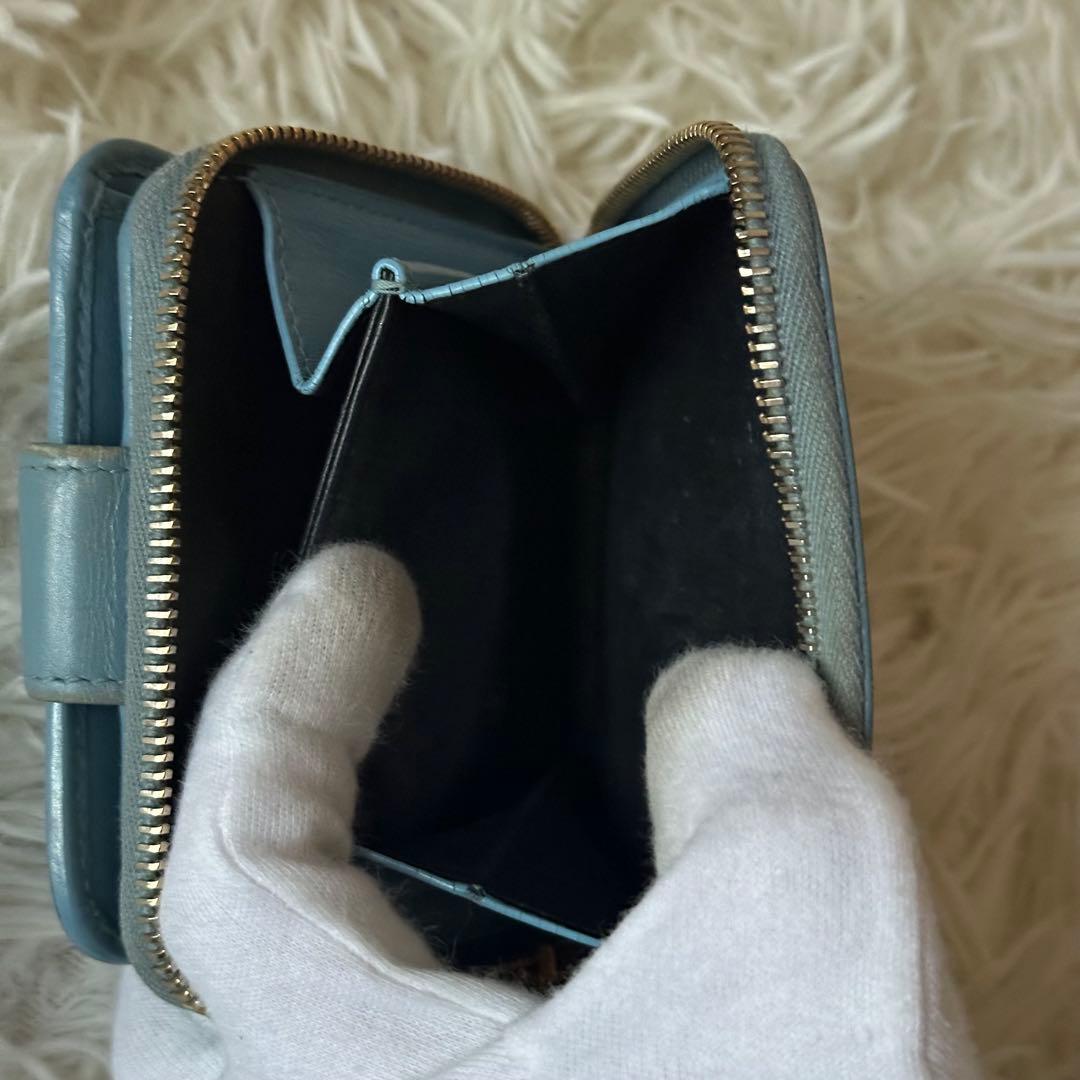 イヴサンローラン 二つ折り財布 型押し レザー ジップ ライトブルー コンパクト