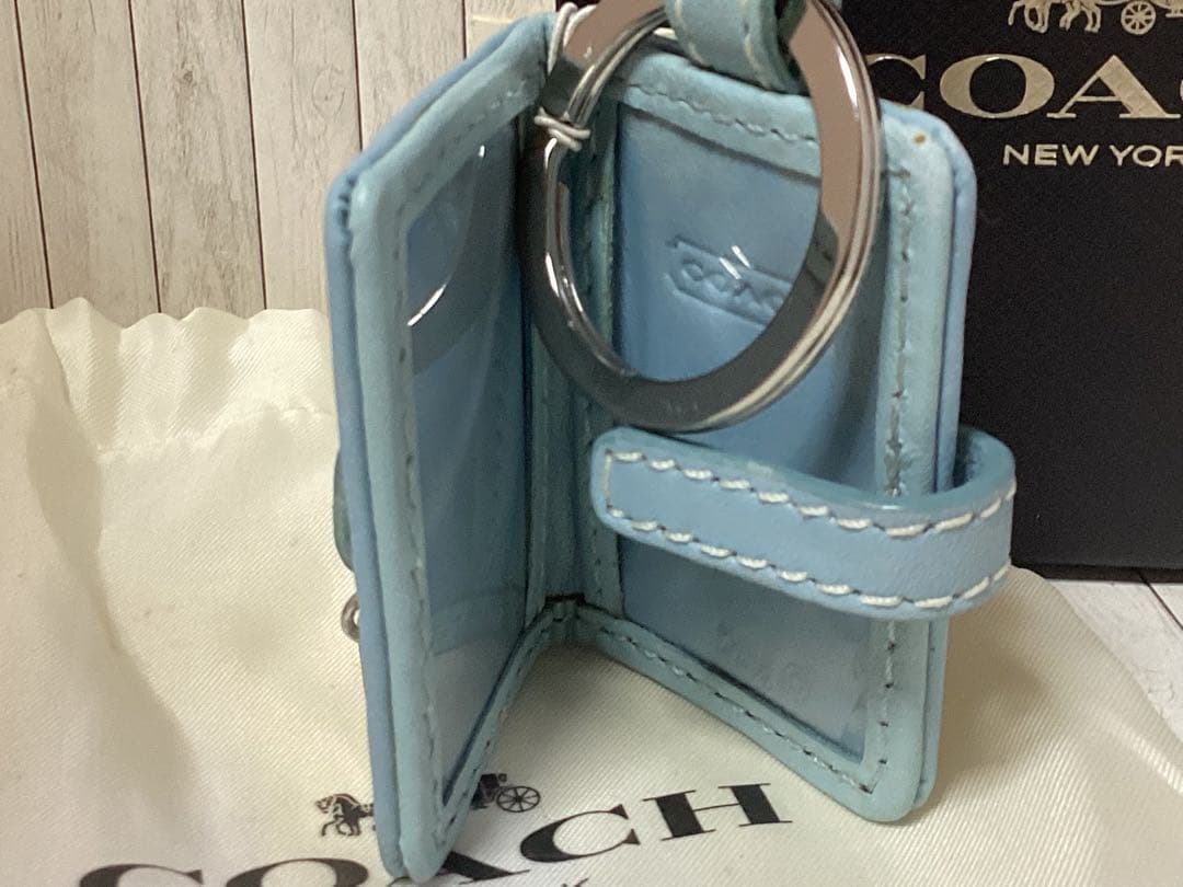 未使用タグ付きCOACH 水色キーホルダーSLC EMB R/C FRAME本物