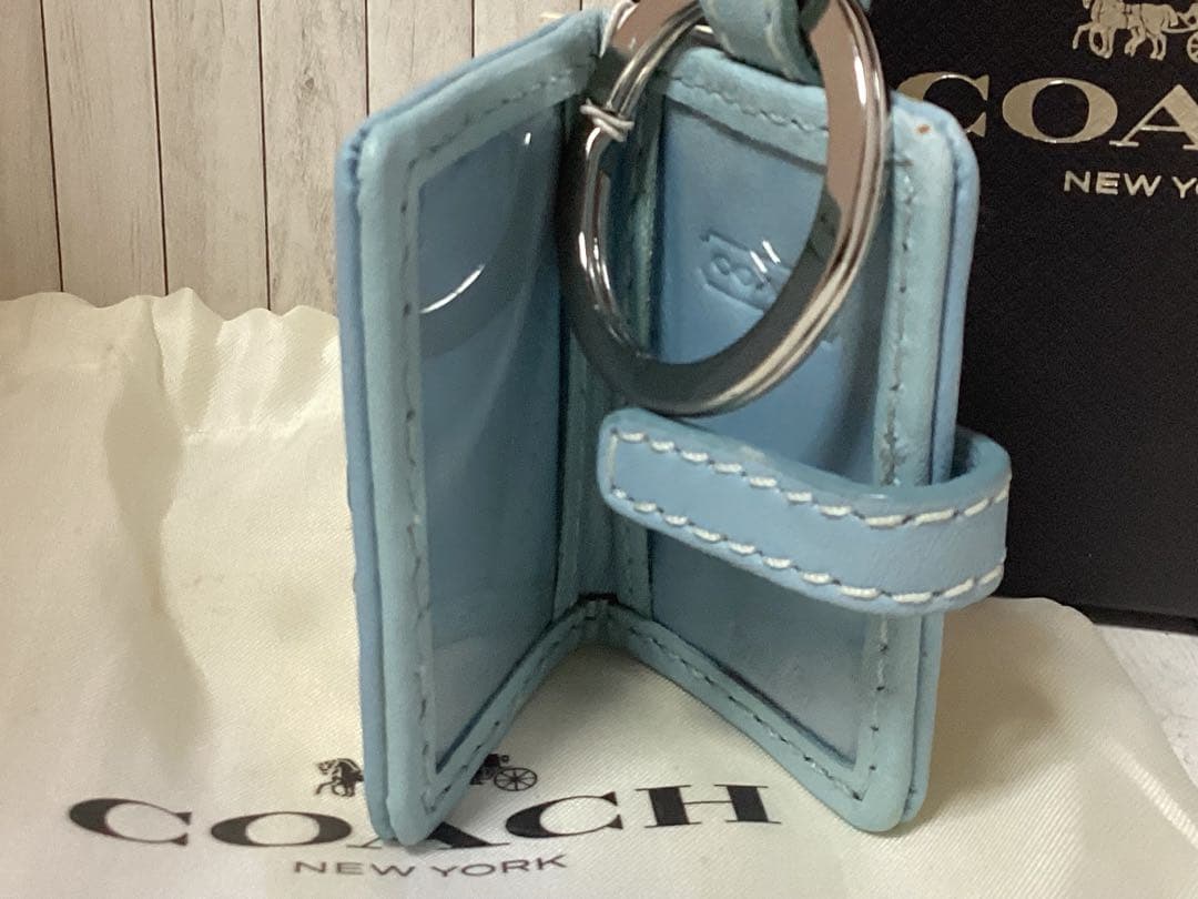 未使用タグ付きCOACH 水色キーホルダーSLC EMB R/C FRAME本物