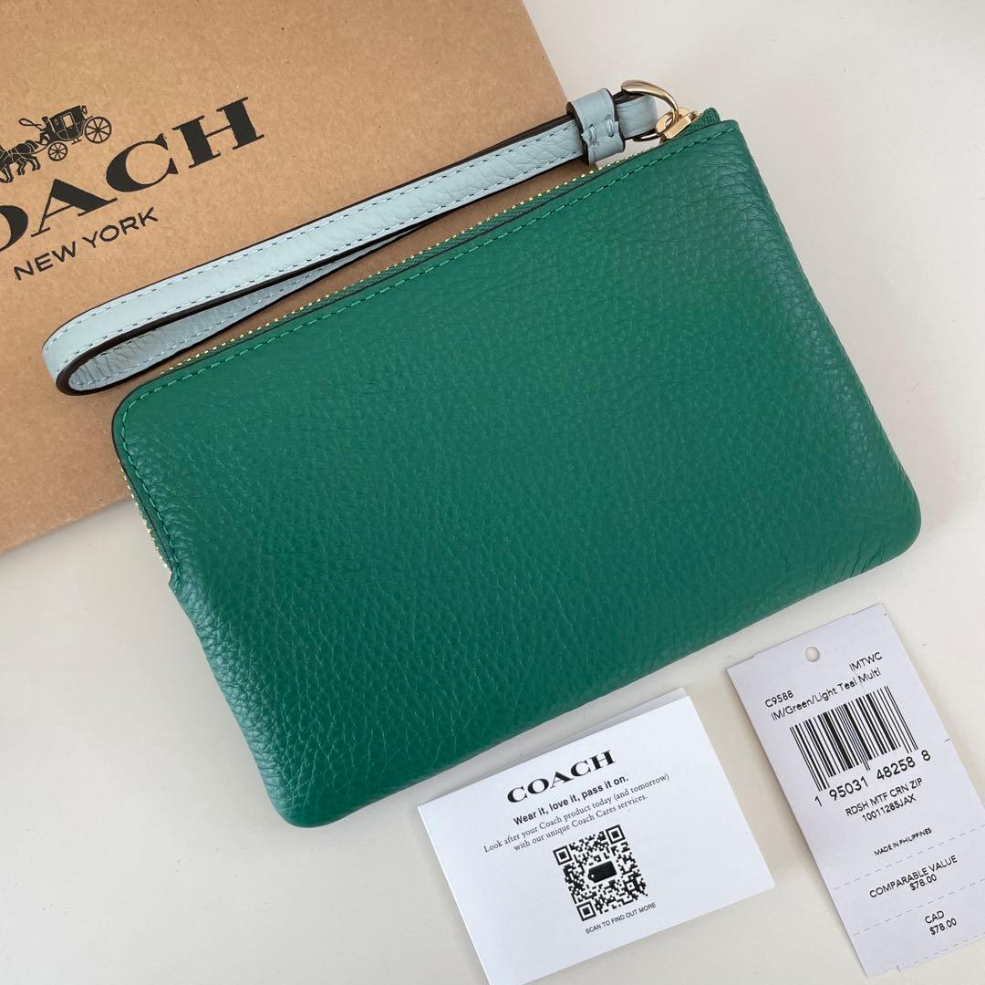 COACH コーチ　ポーチ財布　グリーン　緑色　水色　ラディッシュ柄