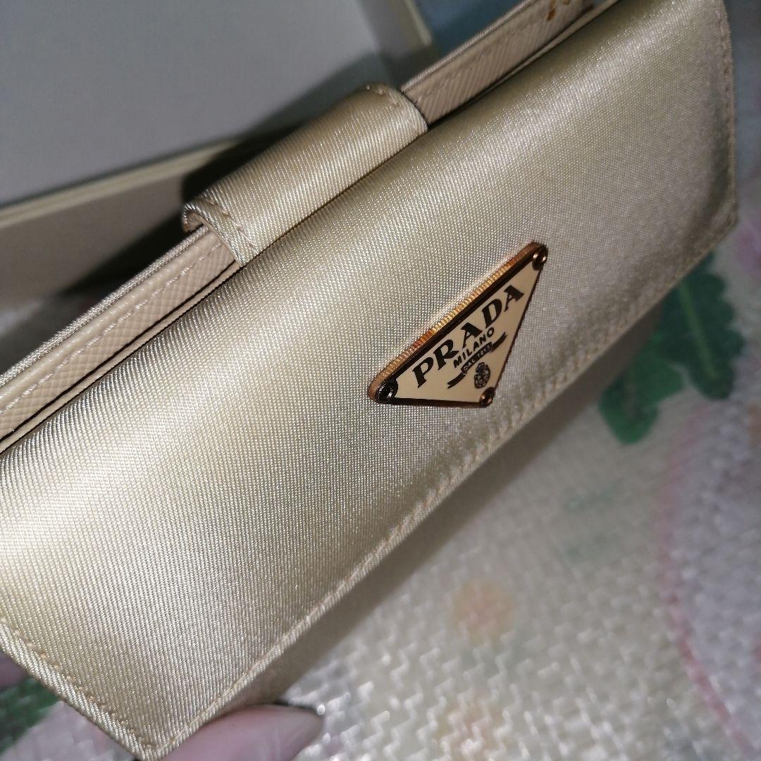 【未使用美品】 PRADA 三つ折り財布 テスート ゴールド ベージュ 三角ロゴ