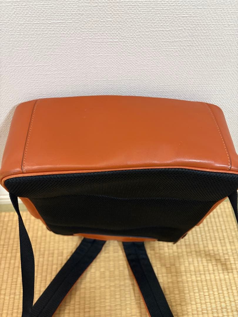 COACH オレンジレザーリュック