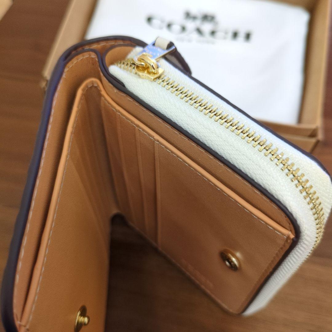 m*u様 COACH 花柄 二つ折り財布