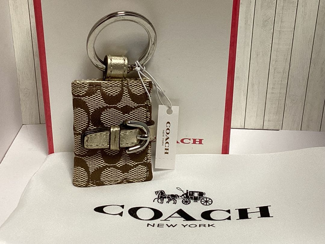 未使用美品タグ付きコーチ写真入れ手帳型COACH ロゴ入ブラウンキーホルダー本物
