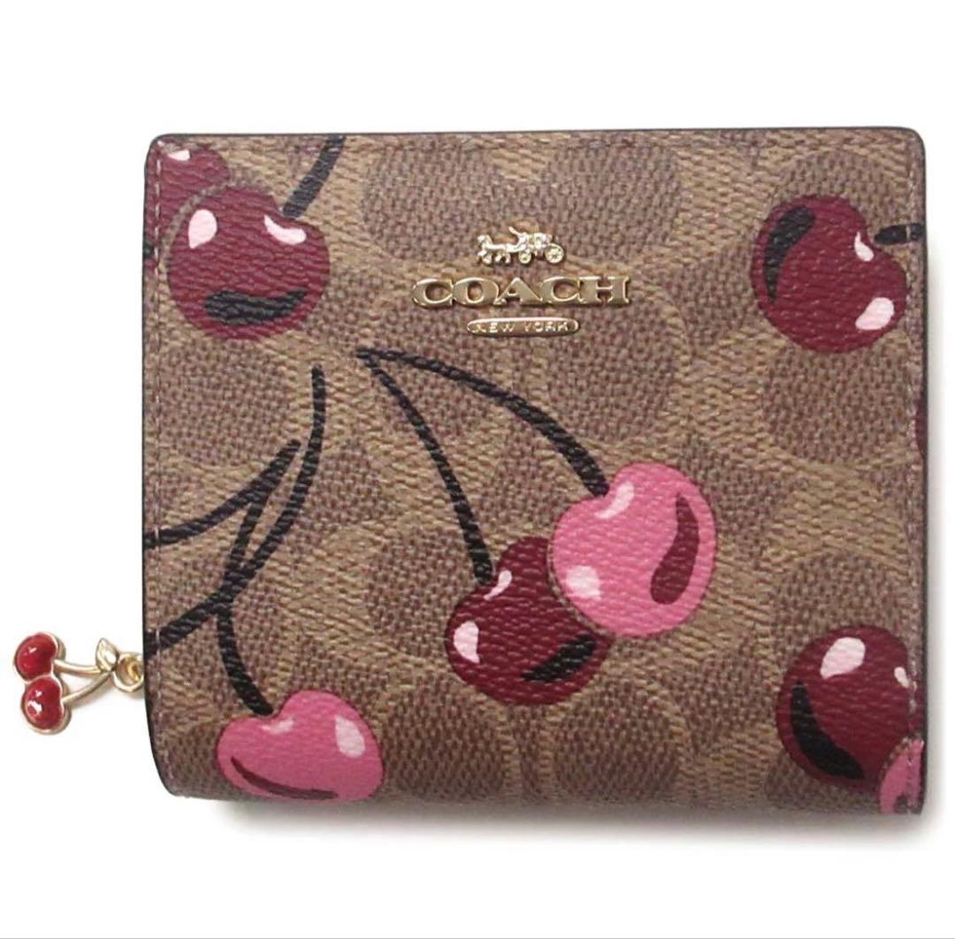 coachコーチチェリープリントチェリープリントシグネチャースナップ二つ折り財布