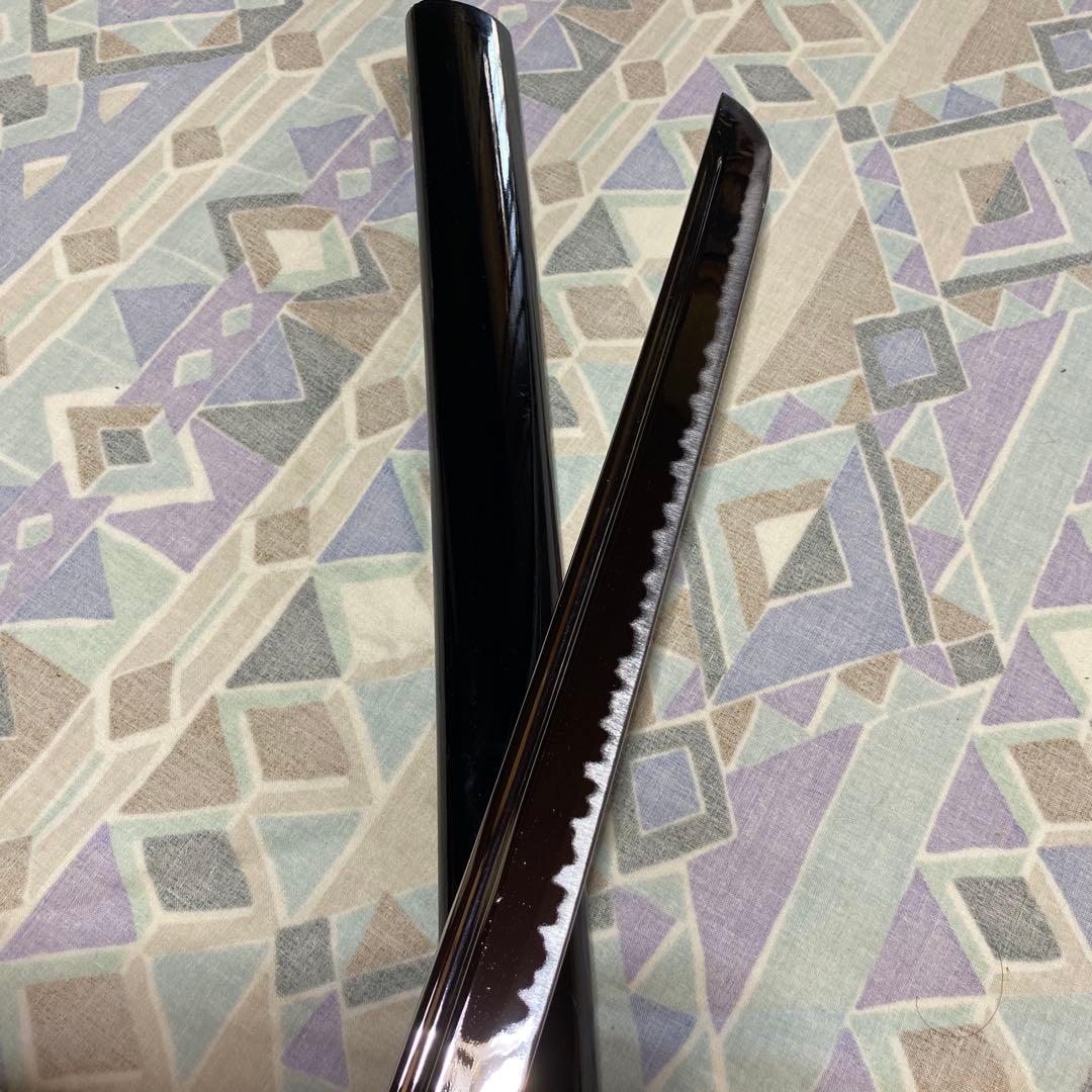 上級居合刀 黒柄 鶴波図楕円鍔 黒呂鞘